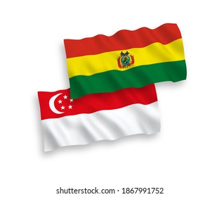 Banderas de olas de tela vectorial nacional de Bolivia y Singapur aisladas en fondo blanco. de 1 a 2.