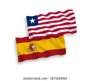 National vector fabric wave flags of Liberia and Spain isolated on white background. 1 to 2 proportion.
