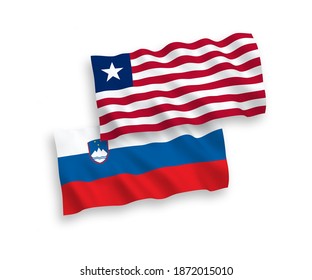 National vector fabric wave flags of Slovenia and Liberia isolated on white background. 1 to 2 proportion.