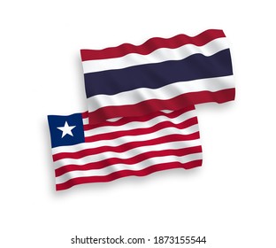 National vector fabric wave flags of Liberia and Thailand isolated on white background. 1 to 2 proportion.