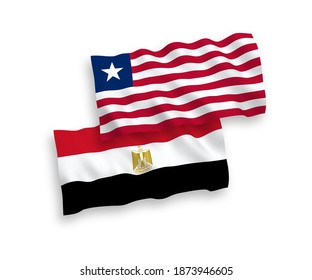 National vector fabric wave flags of Liberia and Egypt isolated on white background. 1 to 2 proportion.