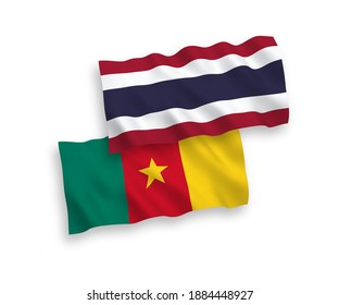 National vector fabric wave flags of Cameroon and Thailand isolated on white background. 1 to 2 proportion.