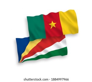 National vector fabric wave flags of Cameroon and Seychelles isolated on white background. 1 to 2 proportion.