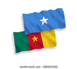 National vector fabric wave flags of Cameroon and Somalia isolated on white background. 1 to 2 proportion.