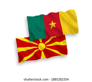 National vector fabric wave flags of Cameroon and North Macedonia isolated on white background. 1 to 2 proportion.