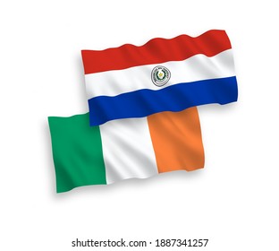 National vector fabric wave flags of Ireland and Paraguay isolated on white background. 1 to 2 proportion.