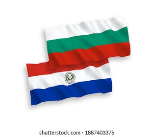 National vector fabric wave flags of Bulgaria and Paraguay isolated on white background. 1 to 2 proportion.