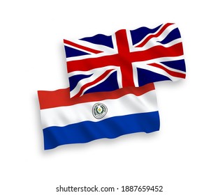 National vector fabric wave flags of Great Britain and Paraguay isolated on white background. 1 to 2 proportion.