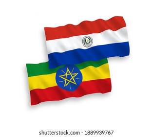 National vector fabric wave flags of Paraguay and Ethiopia isolated on white background. 1 to 2 proportion.