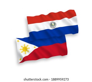 National vector fabric wave flags of Paraguay and Philippines isolated on white background. 1 to 2 proportion.