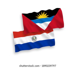 Nationale Vektor-Wellen-Flaggen von Paraguay und Antigua und Barbuda einzeln auf weißem Hintergrund. 1 bis 2 %.
