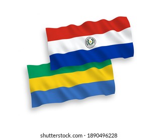 National vector fabric wave flags of Paraguay and Gabon isolated on white background. 1 to 2 proportion.