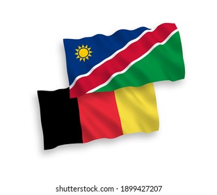 National vector fabric wave flags of Republic of Namibia and Belgium isolated on white background. 1 to 2 proportion.