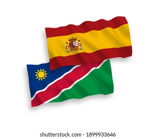 National vector fabric wave flags of Republic of Namibia and Spain isolated on white background. 1 to 2 proportion.