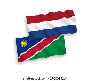 National vector fabric wave flags of Republic of Namibia and Netherlands isolated on white background. 1 to 2 proportion.