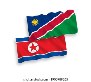 National vector fabric wave flags of North Korea and Republic of Namibia isolated on white background. 1 to 2 proportion.