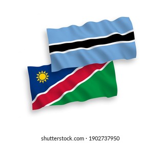 National vector fabric wave flags of Republic of Namibia and Botswana isolated on white background. 1 to 2 proportion.