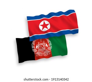 Nationale Vektor-Wellen-Flaggen von Nordkorea und der Islamischen Republik Afghanistan einzeln auf weißem Hintergrund. 1 bis 2 %.