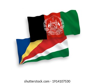 National vector fabric wave flags of Islamic Republic of Afghanistan and Seychelles isolated on white background. 1 to 2 proportion.