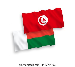 National vector fabric wave flags of Republic of Tunisia and Madagascar isolated on white background. 1 to 2 proportion.
