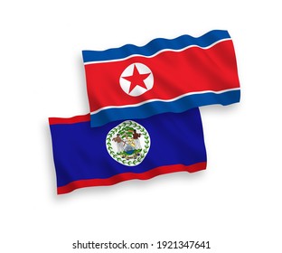 National vector fabric wave flags of North Korea and Belize isolated on white background. 1 to 2 proportion.