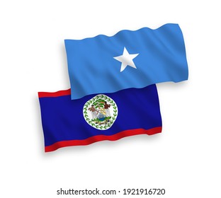 National vector fabric wave flags of Belize and Somalia isolated on white background. 1 to 2 proportion.