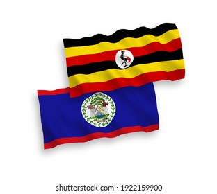 National vector fabric wave flags of Belize and Uganda isolated on white background. 1 to 2 proportion.