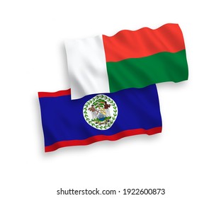 National vector fabric wave flags of Belize and Madagascar isolated on white background. 1 to 2 proportion.