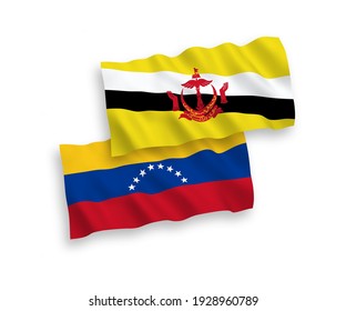 National vector fabric wave flags of Venezuela and Brunei isolated on white background. 1 to 2 proportion.
