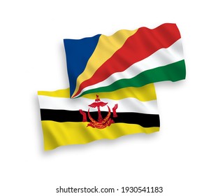 National vector fabric wave flags of Brunei and Seychelles isolated on white background. 1 to 2 proportion.