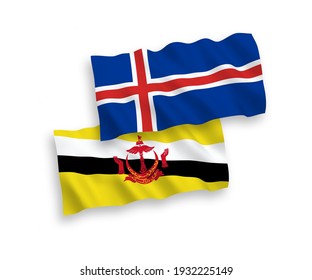 National vector fabric wave flags of Brunei and Iceland isolated on white background. 1 to 2 proportion.