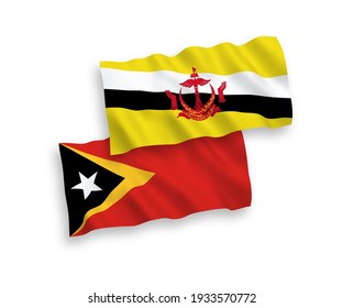 National vector fabric wave flags of Brunei and East Timor isolated on white background. 1 to 2 proportion.