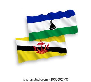 Banderas de ondulación de tela vectorial nacional de Brunei y Lesoto aisladas en fondo blanco. de 1 a 2.