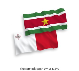 National vector fabric wave flags of Malta and Republic of Suriname isolated on white background. 1 to 2 proportion.