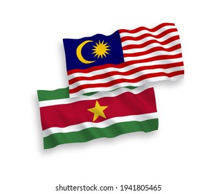 National vector fabric wave flags of Republic of Suriname and Malaysia isolated on white background. 1 to 2 proportion.