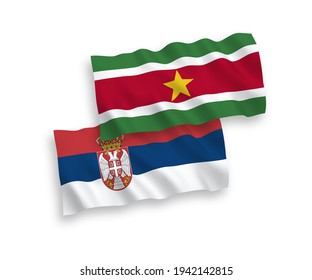 National vector fabric wave flags of Republic of Suriname and Serbia isolated on white background. 1 to 2 proportion.