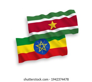National vector fabric wave flags of Republic of Suriname and Ethiopia isolated on white background. 1 to 2 proportion.