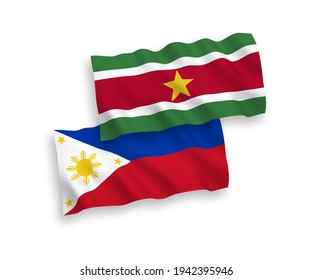 National vector fabric wave flags of Republic of Suriname and Philippines isolated on white background. 1 to 2 proportion.