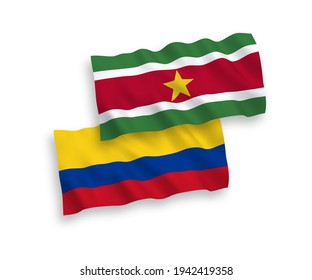 National vector fabric wave flags of Republic of Suriname and Colombia isolated on white background. 1 to 2 proportion.