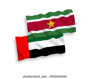 National vector fabric wave flags of Republic of Suriname and United Arab Emirates isolated on white background. 1 to 2 proportion.