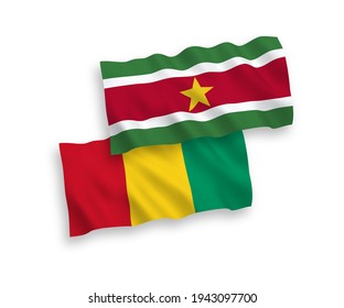 National vector fabric wave flags of Republic of Suriname and Guinea isolated on white background. 1 to 2 proportion.