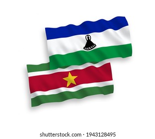 National vector fabric wave flags of Republic of Suriname and Lesotho isolated on white background. 1 to 2 proportion.