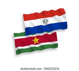 National vector fabric wave flags of Republic of Suriname and Paraguay isolated on white background. 1 to 2 proportion.