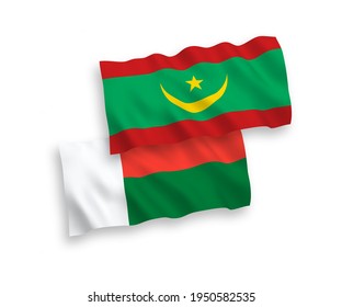 National vector fabric wave flags of Islamic Republic of Mauritania and Madagascar isolated on white background. 1 to 2 proportion.