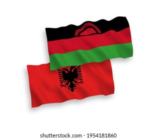 Banderas de olas de tela vectorial nacional de Malawi y Albania aisladas en fondo blanco. de 1 a 2.