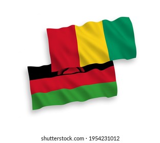 National vector fabric wave flags of Malawi and Guinea isolated on white background. 1 to 2 proportion.