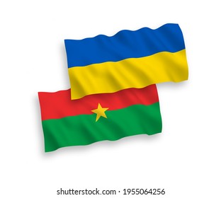National vector fabric wave flags of Burkina Faso and Ukraine isolated on white background. 1 to 2 proportion.