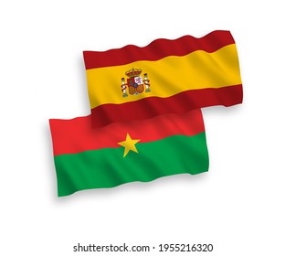 National vector fabric wave flags of Burkina Faso and Spain isolated on white background. 1 to 2 proportion.