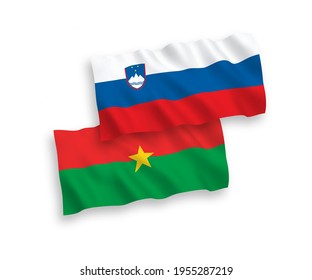 National vector fabric wave flags of Slovenia and Burkina Faso isolated on white background. 1 to 2 proportion.