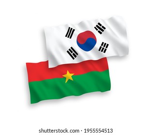 Banderas de olas de tela vectorial nacional de Corea del Sur y Burkina Faso aisladas en fondo blanco. de 1 a 2.
